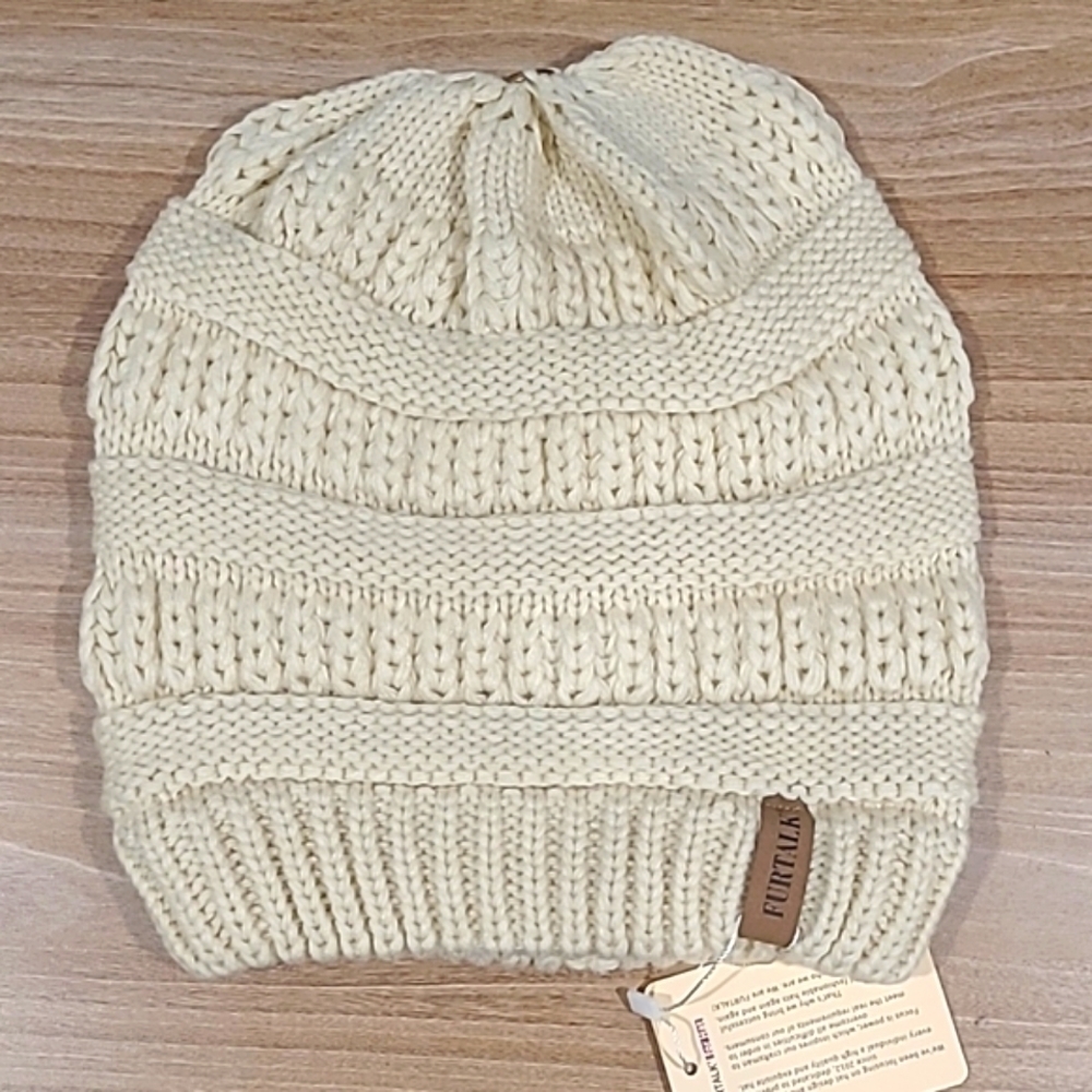 FURTALK knitted cream colored beanie with snap on/off fur ball on top.